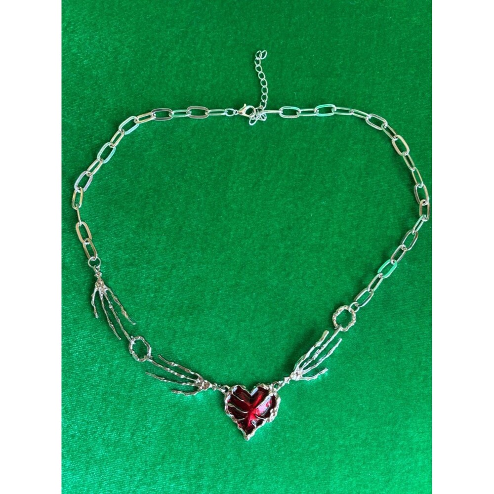 NEW Gothic skeleton hands holding a metallic red heart necklace dark romantic